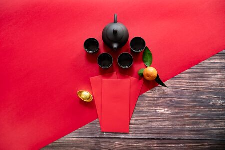 Chinese New Year offering red envelope and Chinese tea pot, Translation of text appear in image: Prosperity, rich and healthyの写真素材