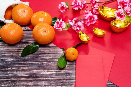 Chinese New Year orange and offering red envelope, Translation of text appear in image: Prosperity, rich and healthyの写真素材