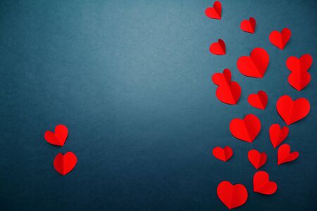 Valentine card with red heart on blue background, abstract, flat lay, top viewの写真素材