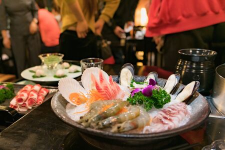 hotpot Chinese sytel with seafood set and belly pork at restaurantの写真素材