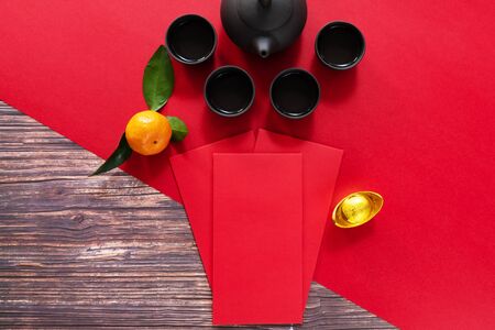 Chinese New Year offering red envelope and Chinese tea pot, Translation of text appear in image: Prosperity, rich and healthyの写真素材