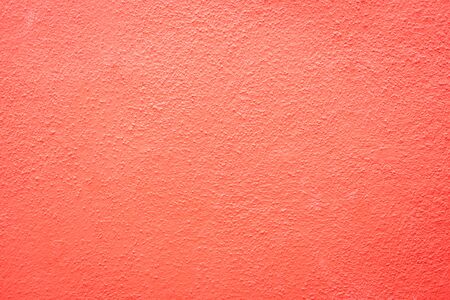 coral pink outdoor wall cement texture abstract backgroundの写真素材