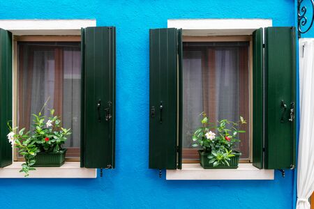 vintage wooden window on blue cement backgroundの写真素材