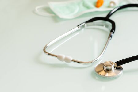 stethoscope mask and medicine, healthcare accessories with copy space on white backgroundの写真素材