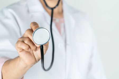 senior doctor or physician hold stethoscope in the hospital. Concept Of Medical Technology and Healthcare Businessの写真素材