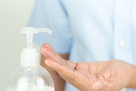 woman hand apply alcohol gel or anti bacteria soap to make cleaning and clear virus, germ, bacteriaの写真素材