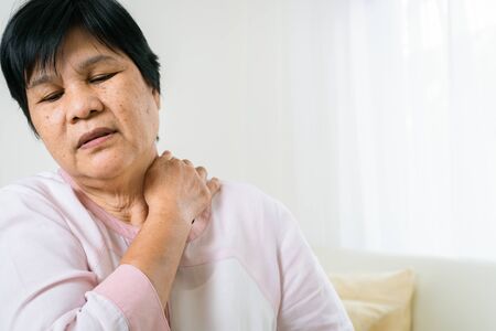 neck and shoulder pain of old woman, healthcare problem of senior conceptの写真素材