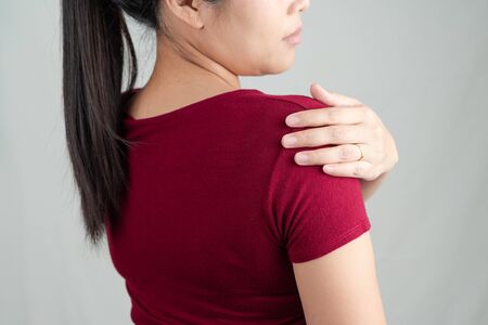neck and shoulder pain, young women injury, healthcare and medical conceptの写真素材