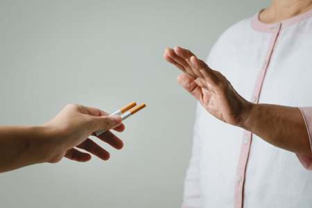 Quit smoking, no tobacco day, mother hands gesture reject proposal the cigarette