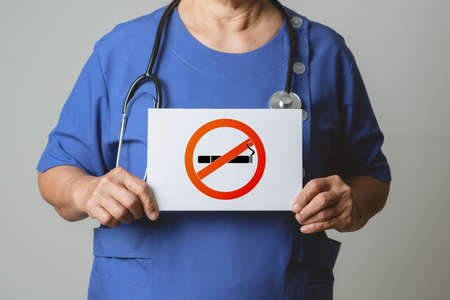 Quit smoking, no tobacco day, doctor holding no smoking signの写真素材
