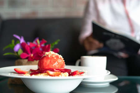 freshly homemade Pancakes Strawberry Crumble on white dessert plateの写真素材
