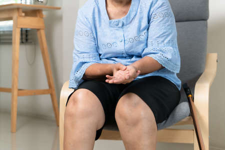 wrist hand pain of old woman, healthcare problem of senior conceptの写真素材