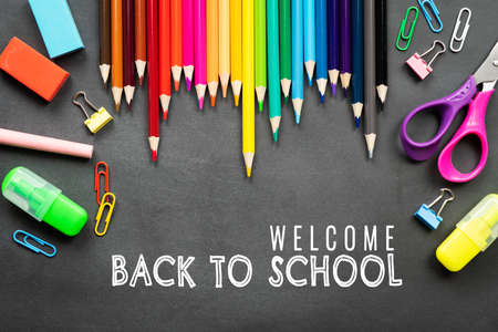 School supplies on black board background. Back to school conceptの写真素材