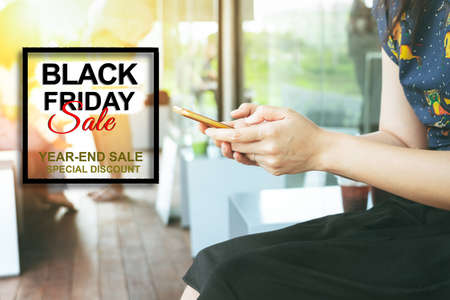 Black Friday Sale, woman hand online shopping on smartphoneの写真素材