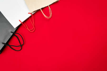 black friday sale, shopping bag on red backgroundの写真素材