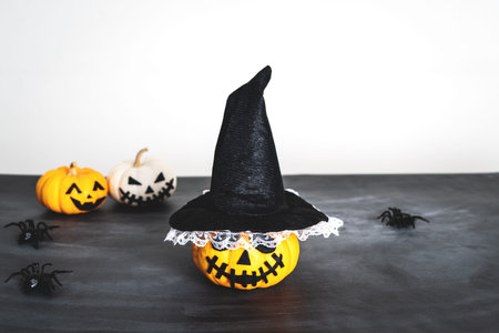Happy Halloween, horror pumpkin and scary spider on black background