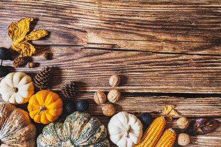 Happy Thanksgiving Day with pumpkin and nut on wooden tableの写真素材
