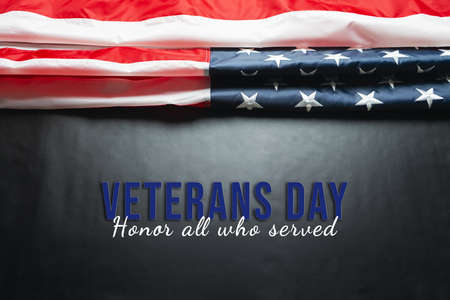 Veterans day. Honoring all who served. American flag on black background.の写真素材