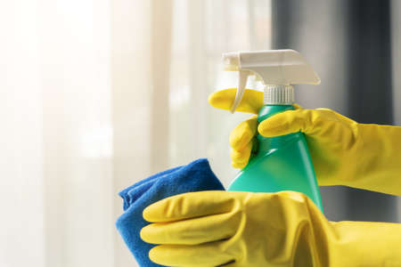 Home cleaning with alcohol cleansing sprayの写真素材