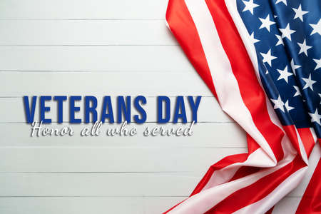 Veterans day with America flag waving on woodenの写真素材