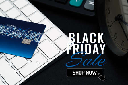 Black Friday sale concept, closeup credit card on black enter button, convenience shopping conceptの写真素材