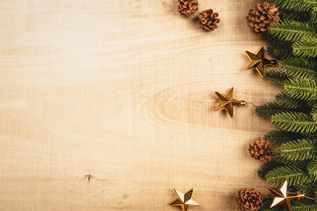 Christmas ball and pine tree with xmas decoration on wooden backgroundの写真素材