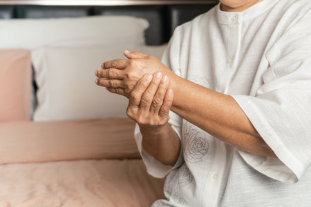 hand pain of old woman, healthcare problem of senior conceptの写真素材