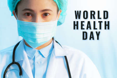 World Health Day concept,  virus stop infection. young female doctor wearing mask with stethoscope against infectious diseases and flu.の写真素材