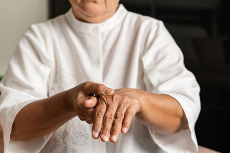 hand pain of old woman, healthcare problem of senior conceptの写真素材