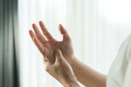 woman wrist arm pain. office syndrome healthcare and medicine conceptの写真素材