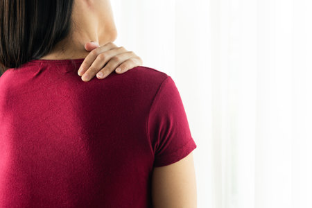 young women neck and shoulder pain injury, healthcare and medical conceptの写真素材