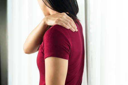 young women neck and shoulder pain injury, healthcare and medical conceptの写真素材