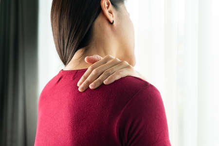 young women neck and shoulder pain injury, healthcare and medical conceptの写真素材