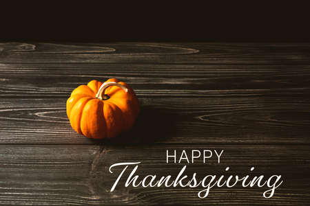Happy Thanksgiving Day with pumpkin on wooden tableの写真素材