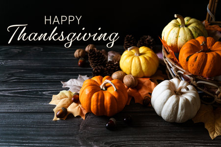 Happy Thanksgiving Day with pumpkin and nut on wooden tableの写真素材