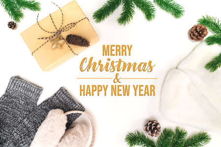 Christmas winter composition. Christmas gifts box with pine cones, fir branches on white background. Flat lay, top view, copy spaceの写真素材