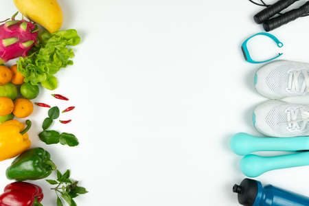 Healthy lifestyle, food and sport concept. athlete's equipment and fresh fruit on white background.の写真素材