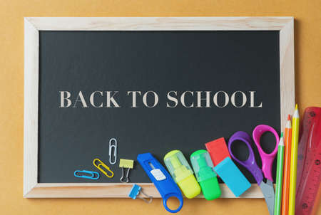 School supplies on black board background. Back to school conceptの写真素材