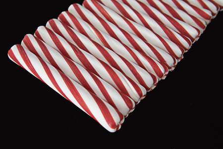 Peppermint Sticks Laying in a Rowの写真素材