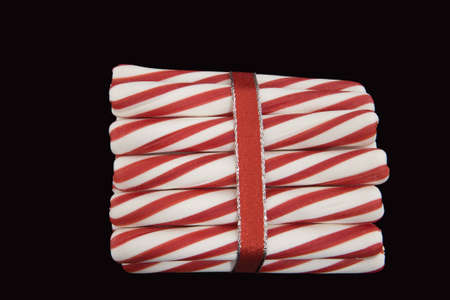Peppermint Sticks Wrapped in a Red Ribbonの写真素材
