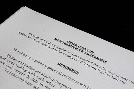 Divorce Child Custody Agreement on black background の写真素材