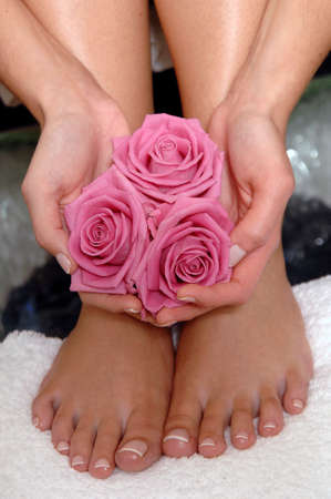a woman holding roses during a SPA treatmentの写真素材
