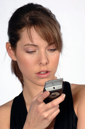 portrait of a young woman using a mobile phoneの写真素材