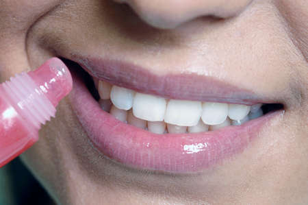 cosmetic of woman's face, lip gloss paintingの写真素材