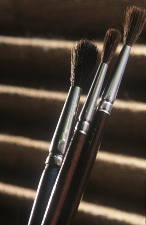 three paint brushes