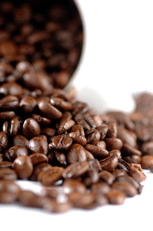Black coffee in a cup, beans on a white background
