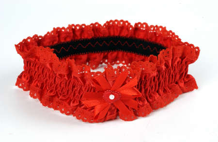 lacy red, garter on a white backgroundの写真素材