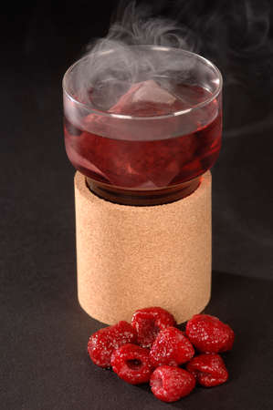 hot herbal tea in a glass, raspberryの写真素材