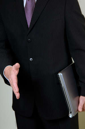 businessman's hand outstretched in greetingの写真素材