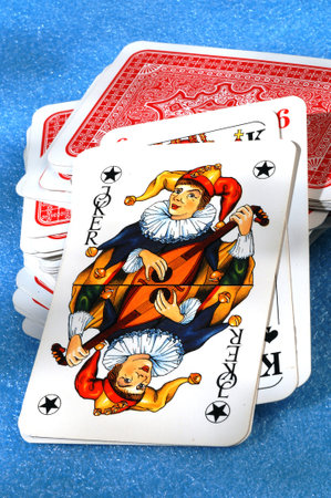 playing cards on a blue backgroundのeditorial素材